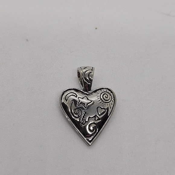 silver tone heart pendant with stars sun and swirls - Picture 1 of 3